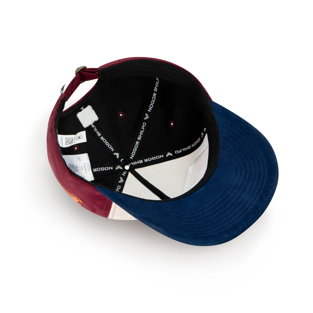 Color-blocked cap with a geometric pattern on a white background