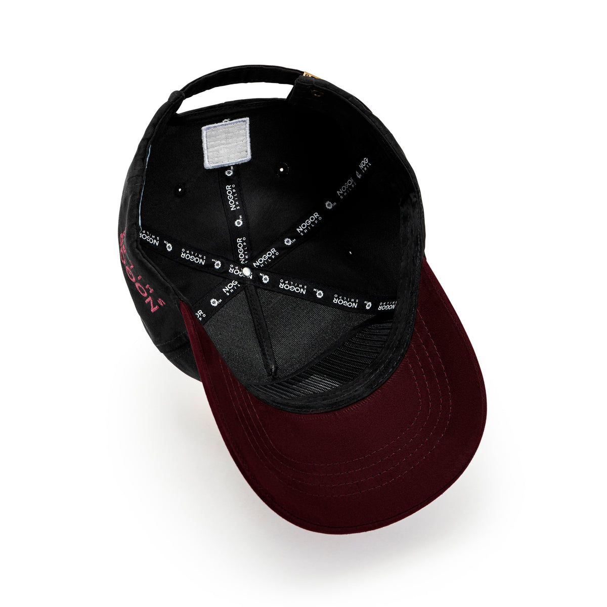 Back view of Nogor Shilpo black and maroon suede cap with adjustable strap