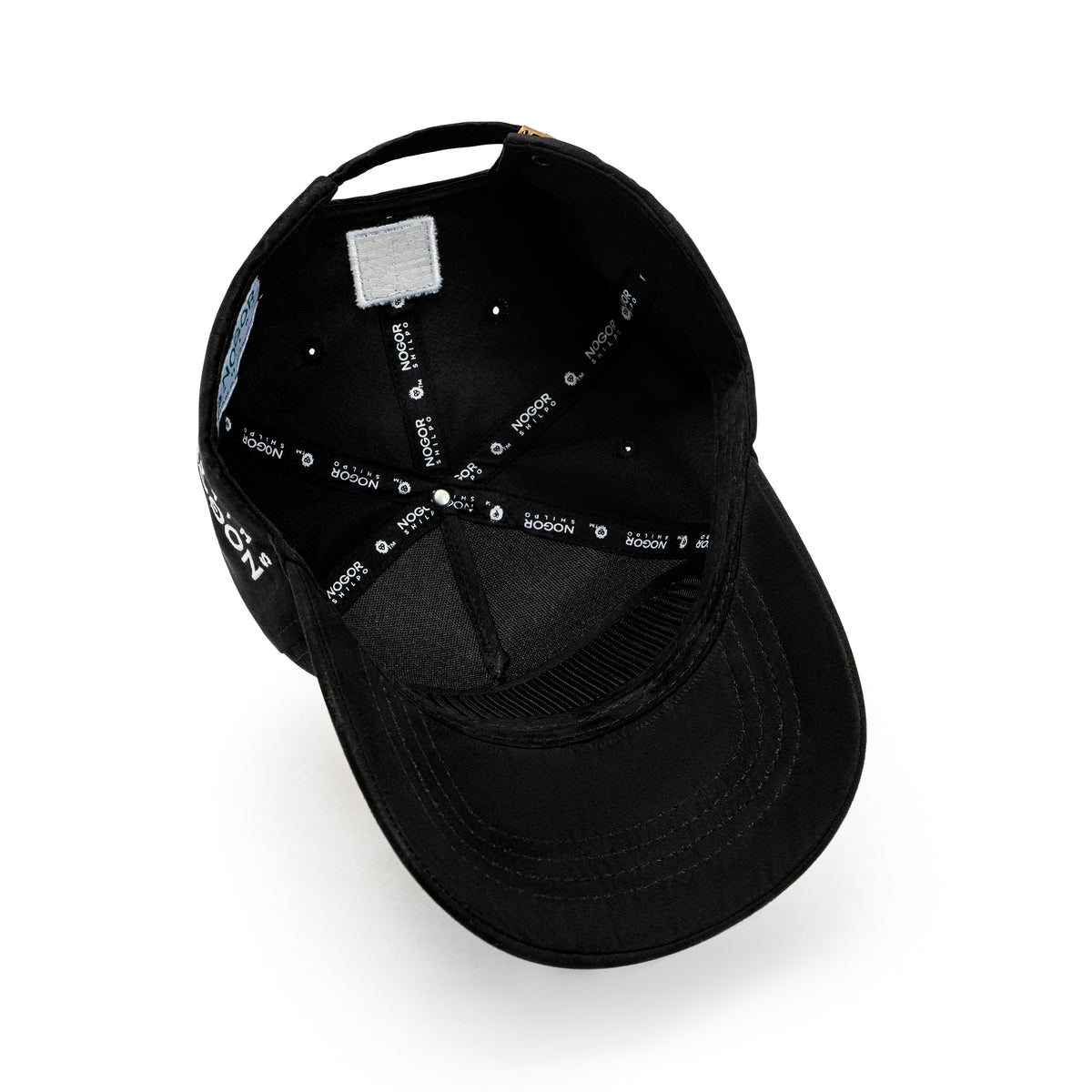 Nogor Shilpo black suede cap side embroidery with Never Stop Dreaming patch