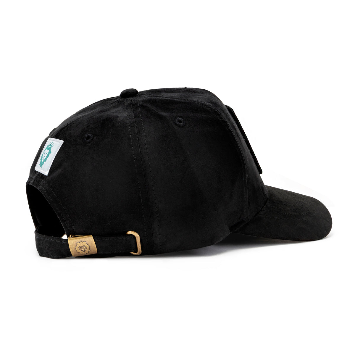 Side view of black suede cap with gold lion logo buckle and white woven lion label